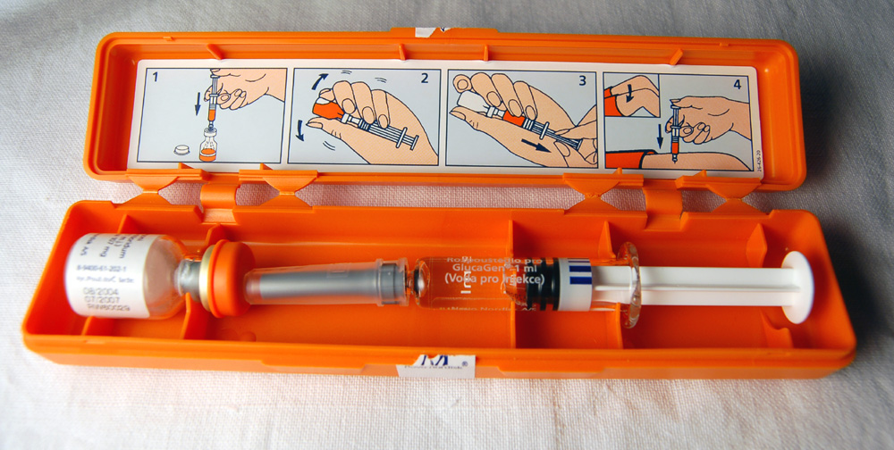 An emergency glucagon kit with vial, syringe and preparation instructions, used when severe hypoglycaemia causes impaired consciousness and oral carbohydrate is unsafe.